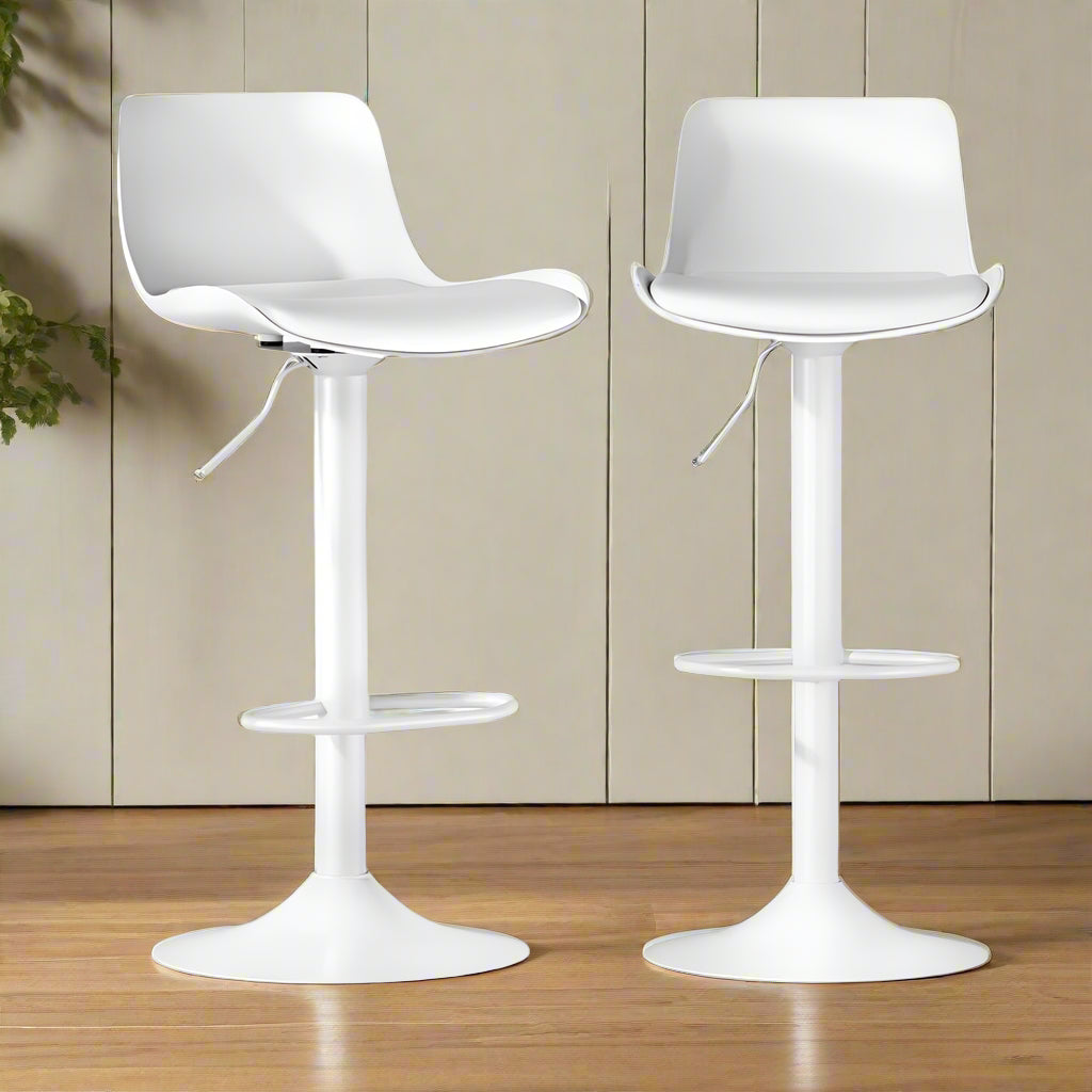 Two white leather padded seat gas lift bar stools with a strong PP backrest, thick foam padded seat, and a semi-circular footrest. The stools are omnidirectional swivel seats with adjustable height and have a large chrome base with a floor protector.