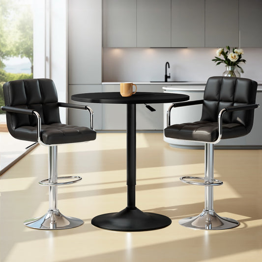 Black bar table with two black leather stools in a modern kitchen setting.