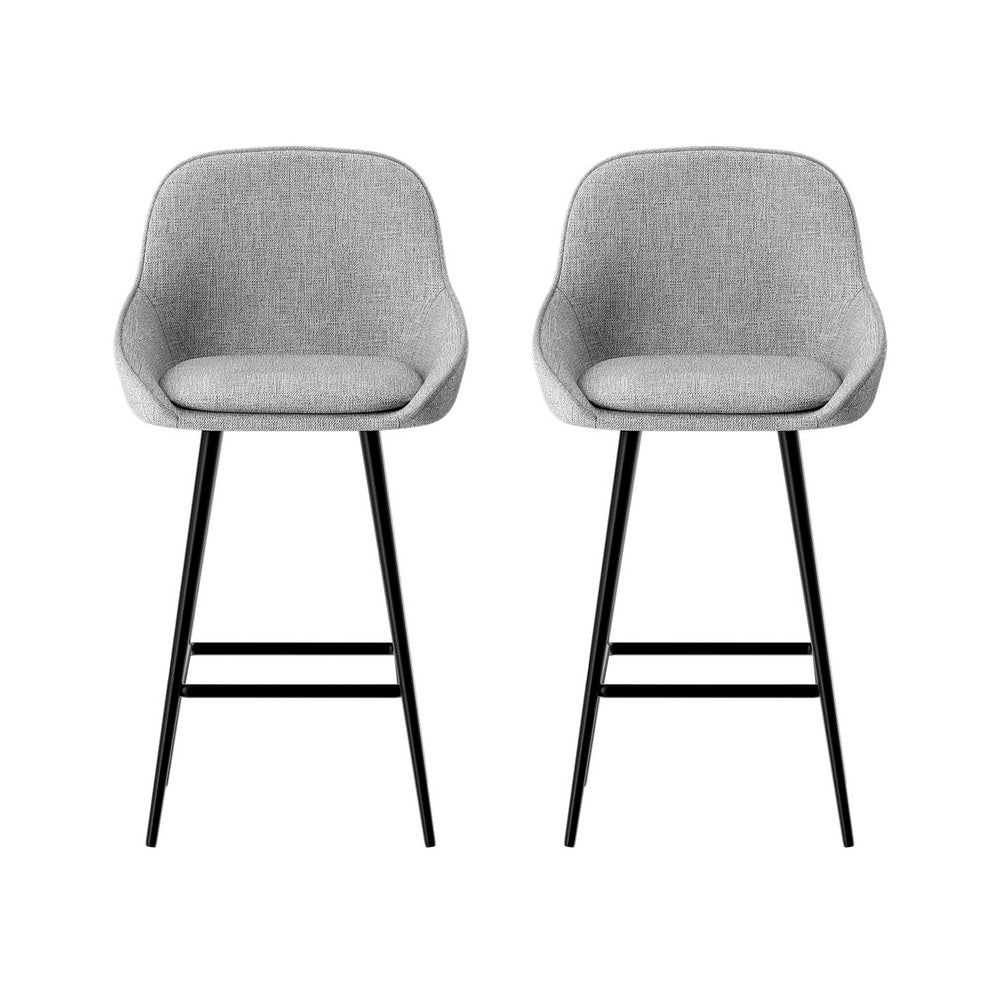 Two gray bar stools with black legs on a white background