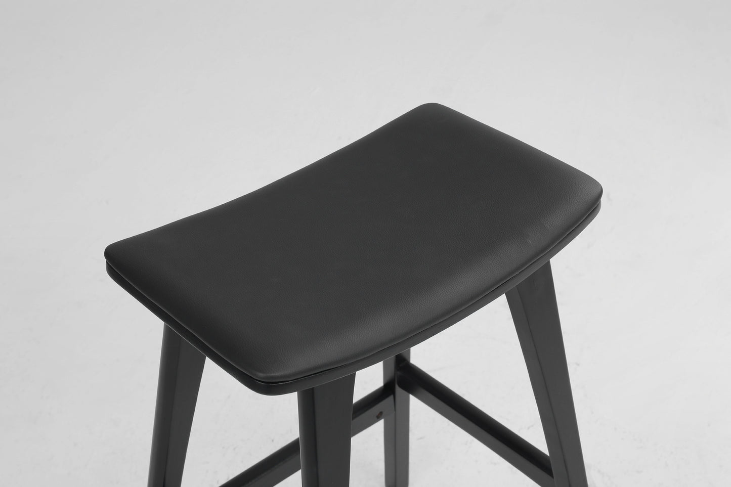 Black bar stool on a light gray background