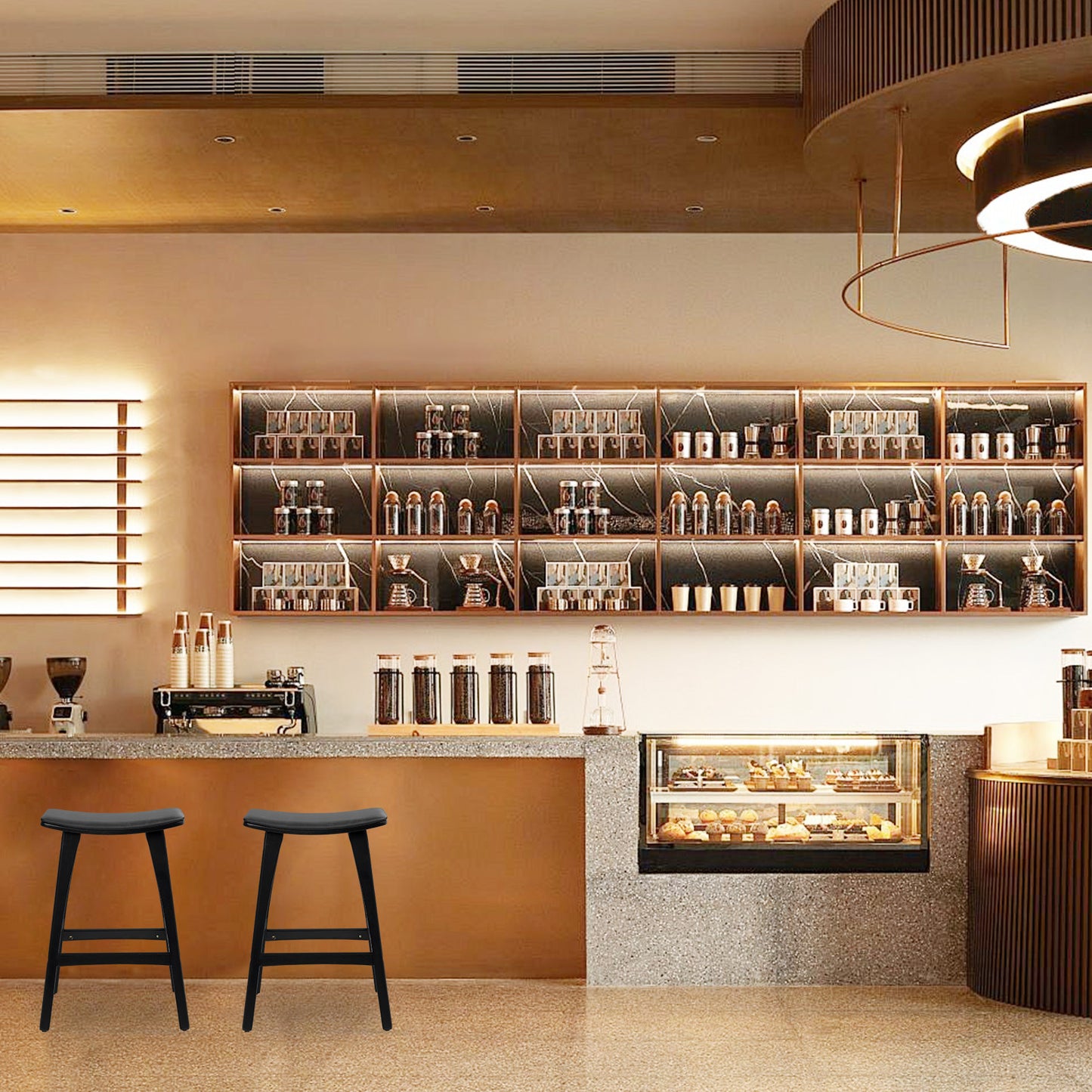Modern coffee shop interior with shelves, counter, and stools.