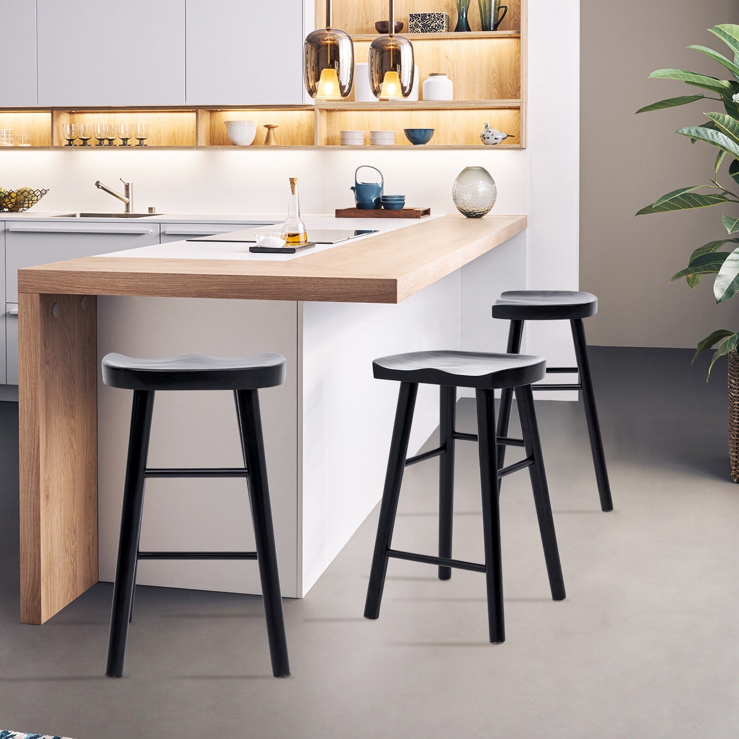 Modern kitchen with wooden counter and black stools