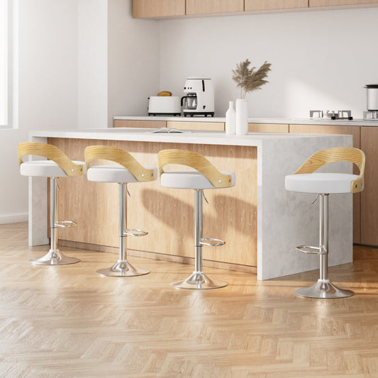 Four bar stools with white seats and wooden backrests in a modern kitchen.