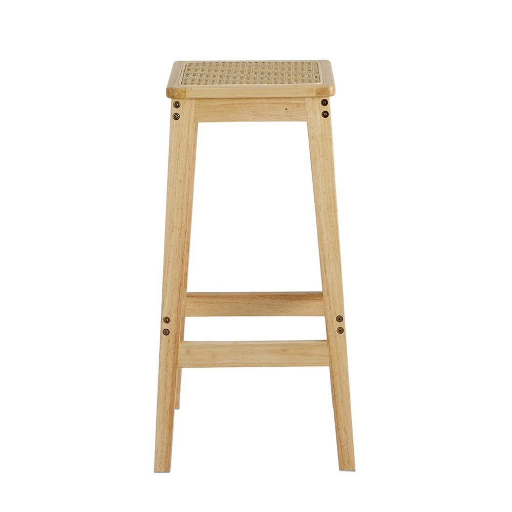 Wooden bar stool with woven rattan seat on a white background
