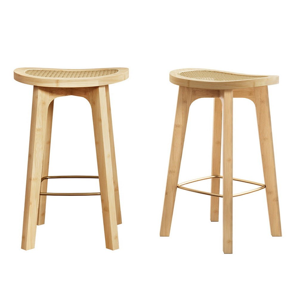 Two wooden bar stools with woven rattan seats on a white background
