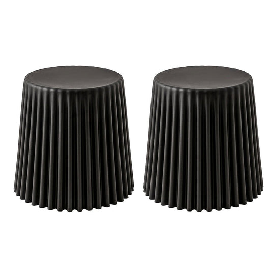 Two black cylindrical stools with pleated texture on a white background