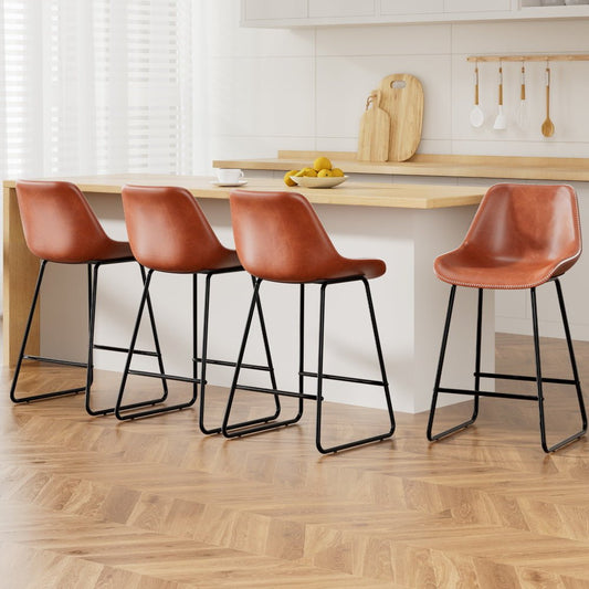 Four brown bar stools with black legs in a kitchen setting.
