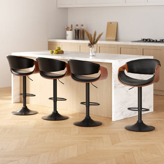 Four black bar stools with wooden seats around a kitchen island.