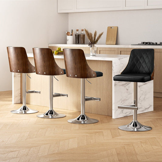 Set of four wooden bar stools in a modern kitchen setting with a black stool.