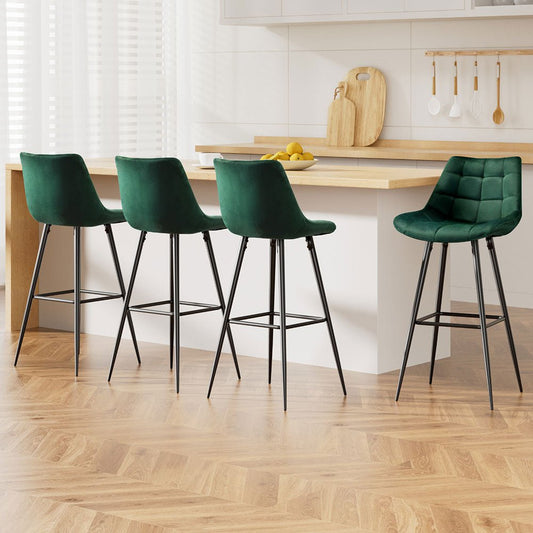 Four green bar stools with black legs in a kitchen setting
