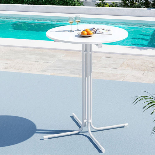 White outdoor table with wine glasses and fruit by a pool