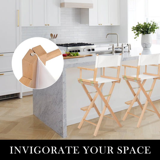 Modern kitchen with light cabinets and a pair of Oxford beechwood tall director chairs around an island bench