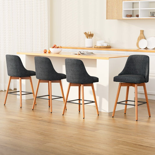 Four charcoal bar stools with wooden legs in a kitchen setting