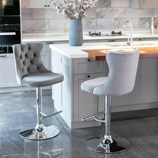 Two grey bar stools in a modern kitchen setting