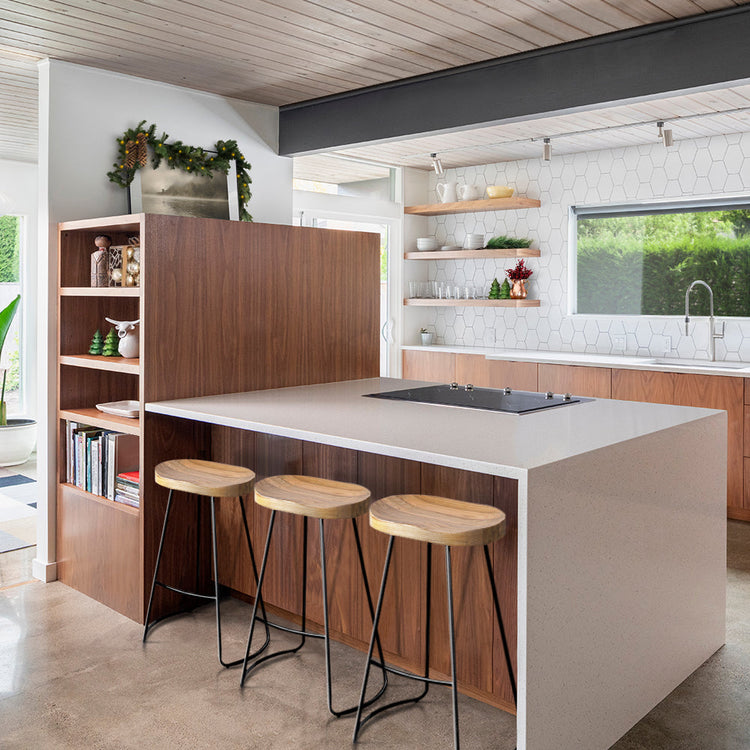 Modern kitchen island with timber bar stools in a contemporary Australian home