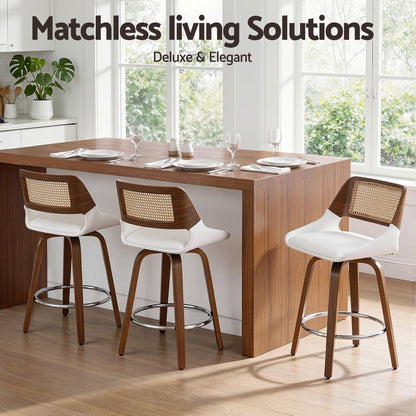Dining area with wooden table and chairs in a bright room, featuring 'Matchless Living Solutions' branding.