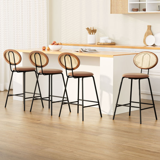 Four bar stools with brown seats and black legs in a kitchen setting.