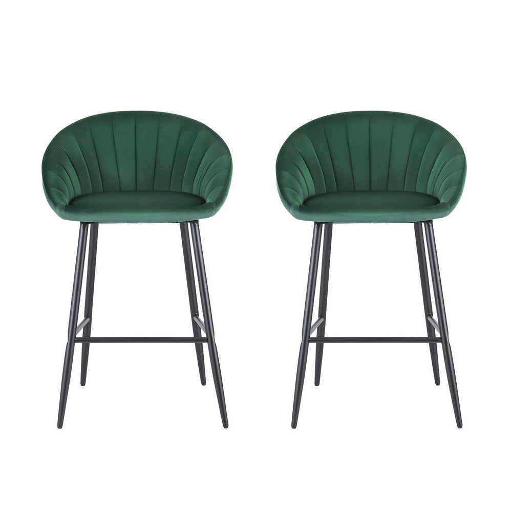 Two green bar stools with black metal legs on a white background