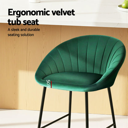 Green ergonomic velvet tub seat with text on a wooden background