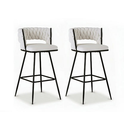 Two white bar stools with black metal legs on a white background