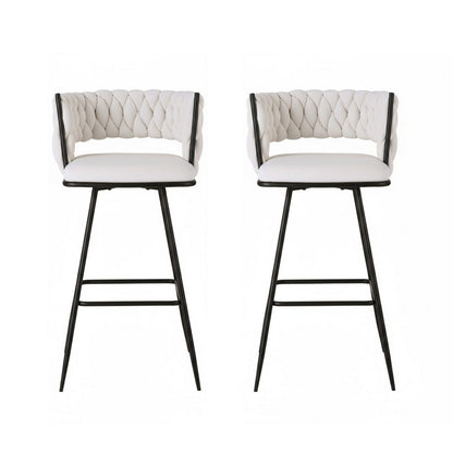 Two white bar stools with quilted backrests on a white background