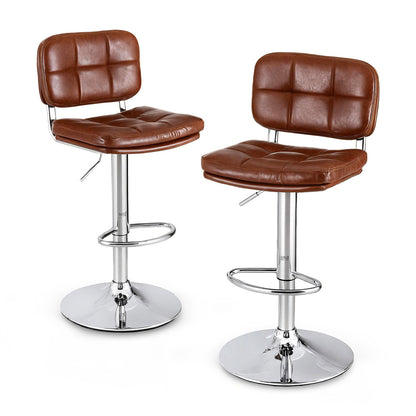 Two brown leather bar stools with chrome bases on a white background