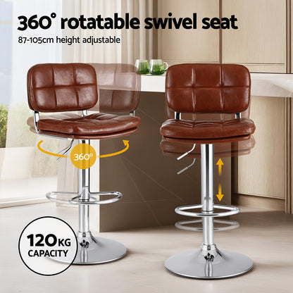Two brown bar stools with a 360-degree swivel seat and height adjustment feature in a kitchen setting.