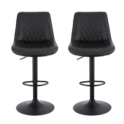Two black bar stools with quilted seats on a white background