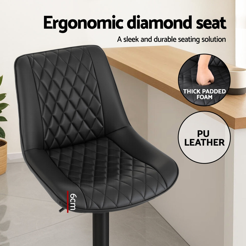 Black ergonomic diamond seat with text highlighting features like thick padded foam and PU leather, set against a neutral background.