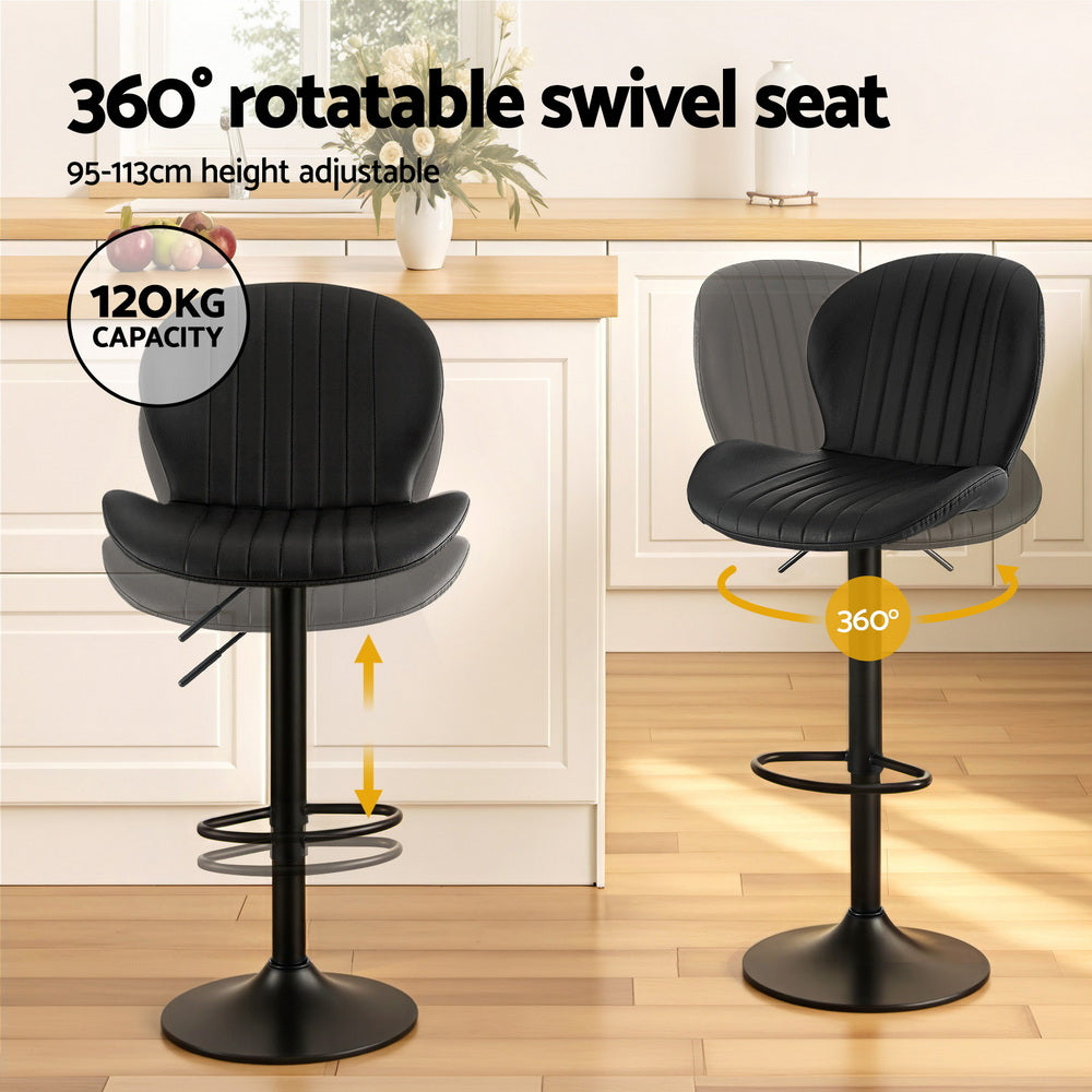 Two black bar stools with 360-degree swivel seat feature on a kitchen floor.