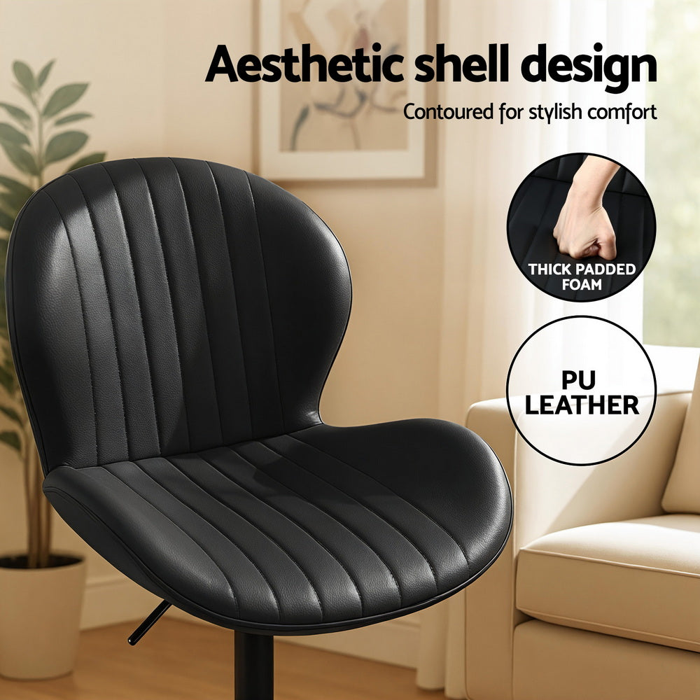 Black cushioned chair with text highlighting features like 'thick padded foam' and 'PU leather' in a home setting.