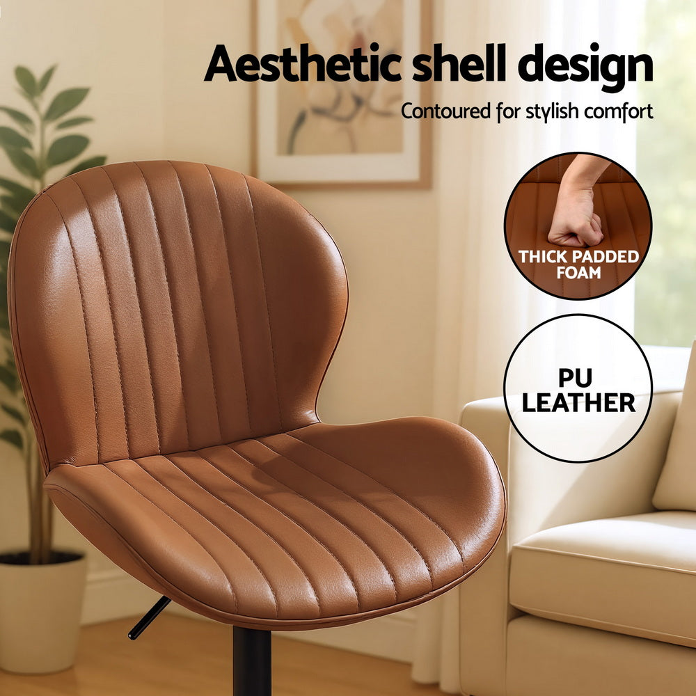 Brown leather chair with text highlighting 'Aesthetic shell design' and 'PU Leather'.