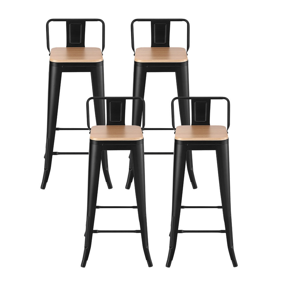 Four black metal bar stools with wooden seats on a white background