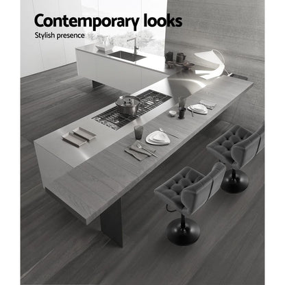 Modern kitchen with gray countertops and stools, featuring the text 'Contemporary looks'.