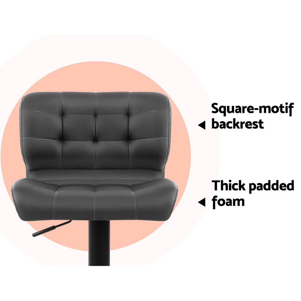 Black office chair with square-motif backrest and thick padded foam on a white background