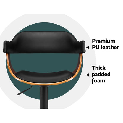 Close-up of a bar stool backrest and seat with text callouts reading 'Premium PU leather' and 'Thick padded foam' on a white background with a teal circular backdrop.