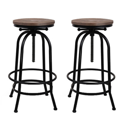 Two bar stools with wooden seats and black metal frames on a white background