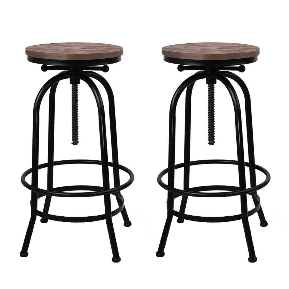 Two bar stools with wooden seats and black metal frames on a white background