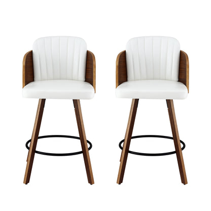 Two white bar stools with wooden legs on a white background