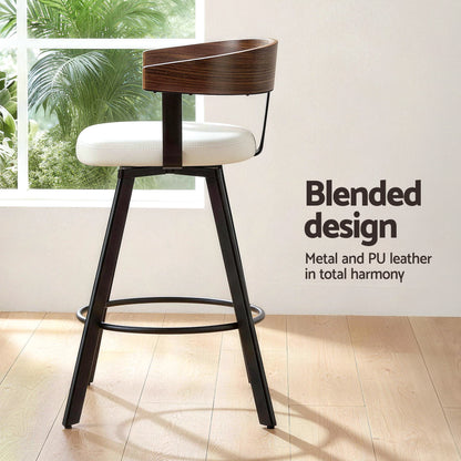 Bar stool with wooden backrest and white seat in a room with a window and plants.