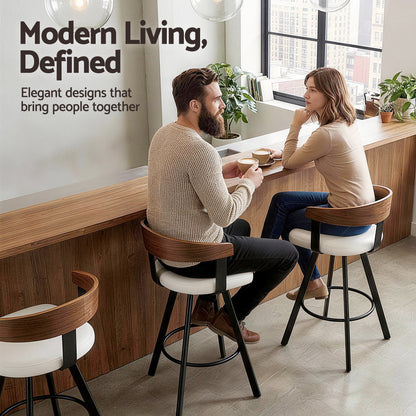 Two people sitting at a counter in a modern cafe with 'Modern Living, Defined' text.