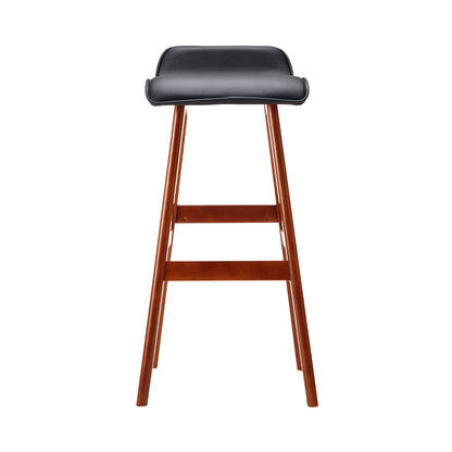 Bar stool with black seat and wooden legs on a white background