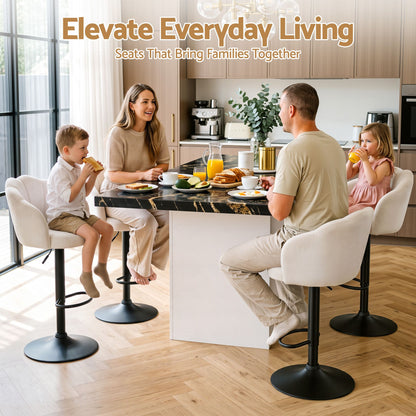 Family seated on ivory velvet swivel bar stools around a modern kitchen island with black pedestal bases.