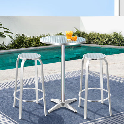 Apex aluminium round bar table and two stools with pool background