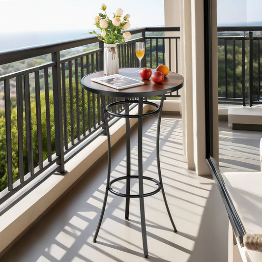 High table with a vase of flowers, fruit, and a newspaper on a balcony with a scenic view.