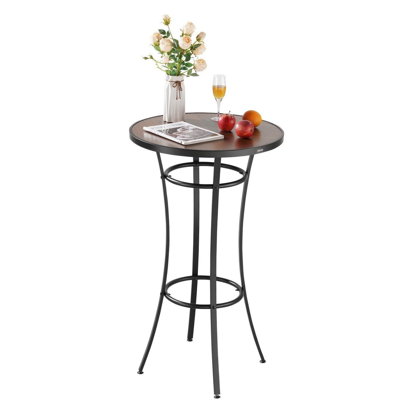Round bar table with a vase of flowers, glass, and apples on a white background