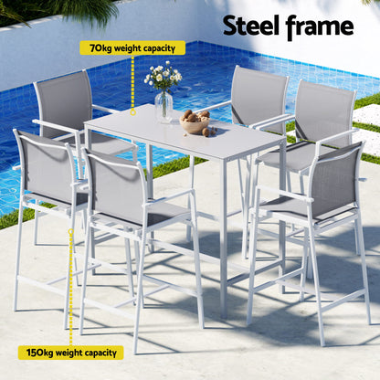 Outdoor dining set with table and chairs by a pool, featuring a steel frame.