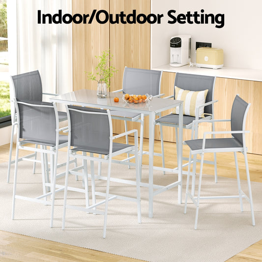 Outdoor dining set with table and chairs on a patio