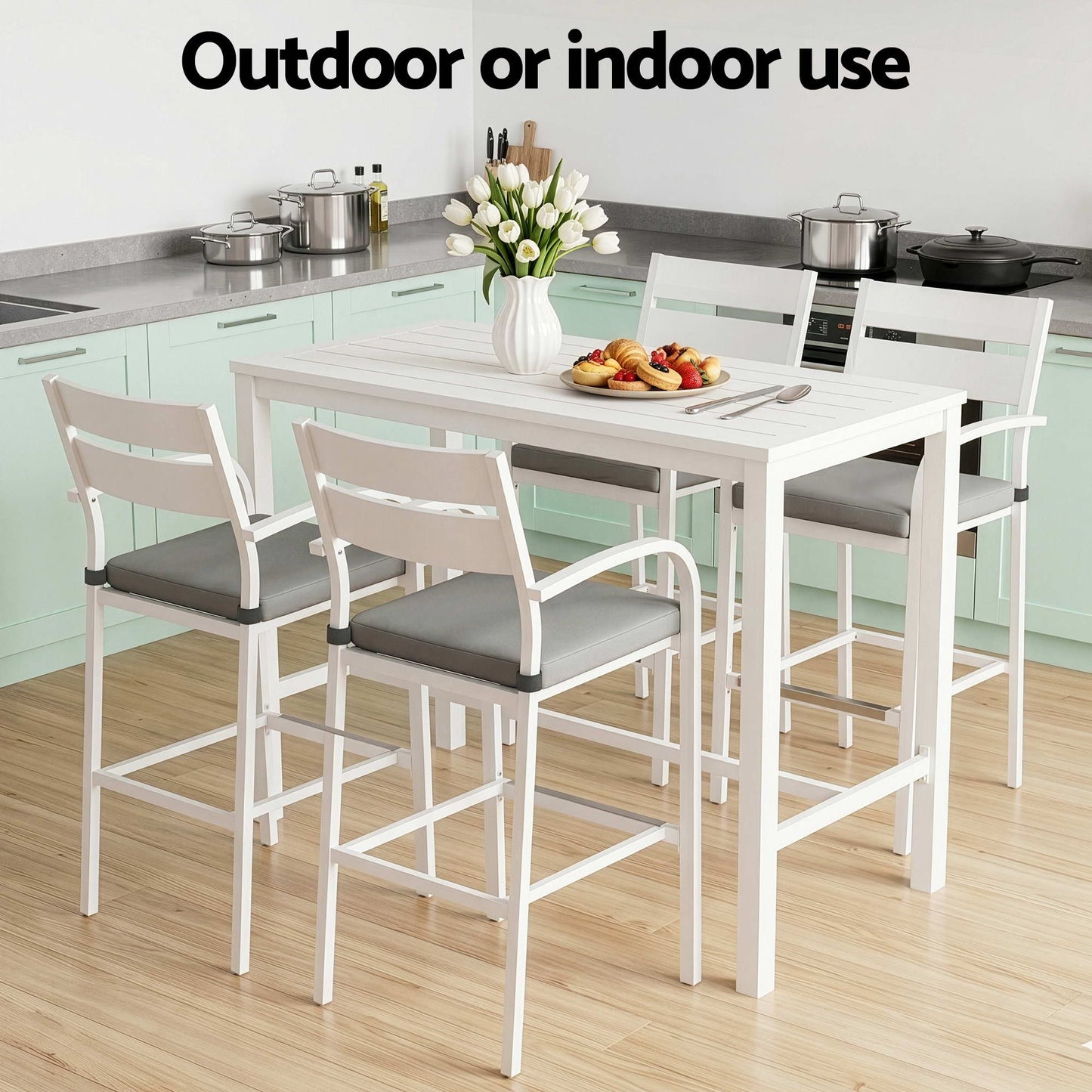 White dining table with four chairs in a kitchen setting, with text 'Outdoor or indoor use'.