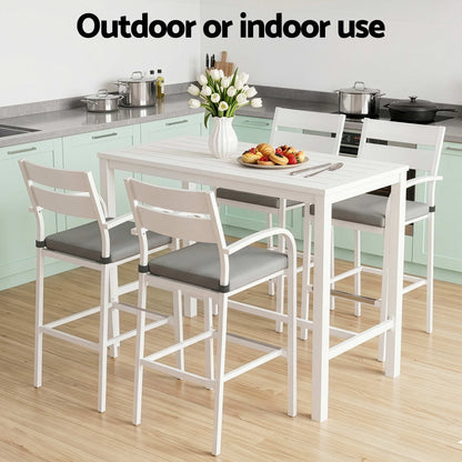 White dining table with four chairs in a kitchen setting, with text 'Outdoor or indoor use'.